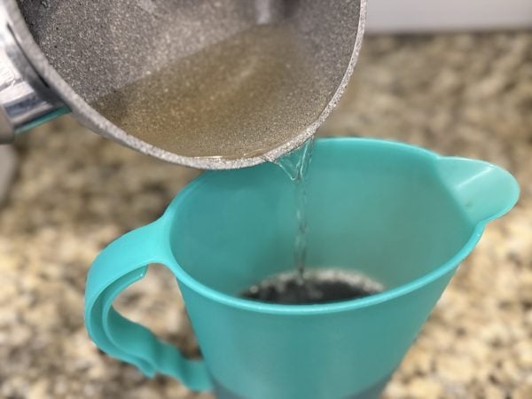 Southern Sweet Tea Recipe pour simple syrup into pitcher