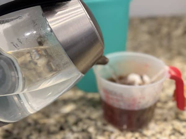 Southern Sweet Tea Recipe pour boiling water into measuring cup
