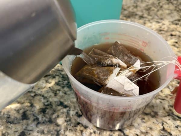 Southern Sweet Tea Recipe measuring cup with tea bags