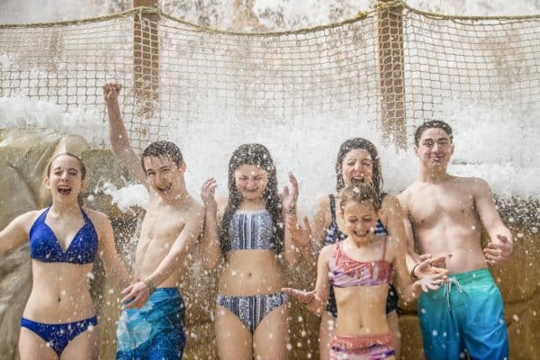 Kids in a range of ages enjoying the waterpark at Great Wolf Lodge.